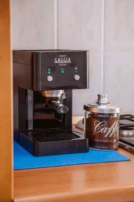 a coffee maker on a counter with a pot of coffee at Luisa Flat - Metro Basilica San Paolo - Wi-Fi in Rome