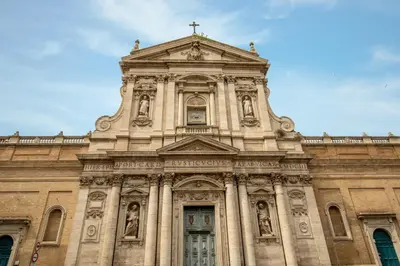 a building with a cross on top of it at Daplace - Santa Susanna Suites in Rome