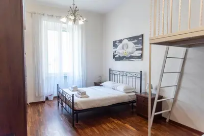 a bedroom with a bunk bed and a ladder at A due passi dal Vaticano in Rome