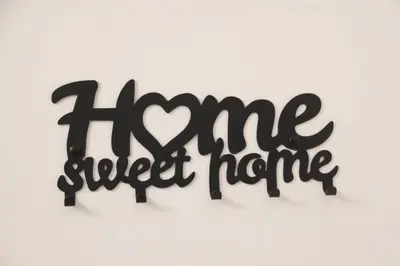 a sign that reads home sweet home with a heart at Appartamento Hector in Rome