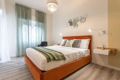 a bedroom with a large bed and a window at CORNELIA COZY&ELEGANCE FLAT in Rome
