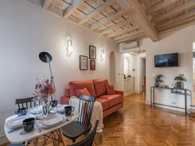 a living room with a couch and a table at The Best Rent - Spacious two-bedroom apartment in old town in Rome