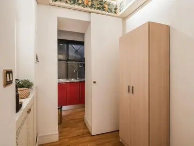a hallway with a cabinet in a kitchen at The Best Rent - Spacious two-bedroom apartment in old town in Rome