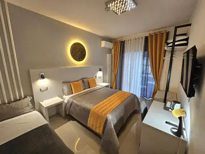 a hotel room with a bed and a couch at St.Peter's Moon in Rome