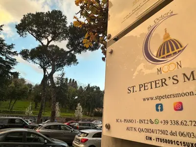 a sign for the moon st peters market in a parking lot at St.Peter's Moon in Rome