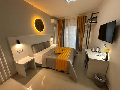 a bedroom with a bed and a desk and a television at St.Peter's Moon in Rome
