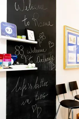 a chalkboard wall with writing on it in a room at ArtHouse Termini in Rome