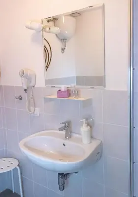 a bathroom with a sink and a mirror at ArtHouse Termini in Rome