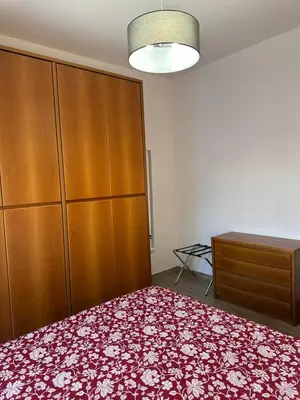a bedroom with a bed and a dresser at Casa Giorgia a 4 fermate metro dal Vaticano in Rome