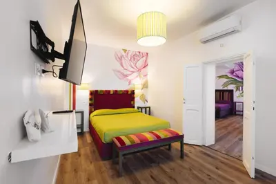 a room with a bed and a tv in it at Famo Pace apartments in Rome