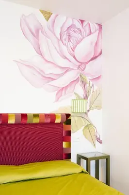 a bedroom with a flower mural on the wall at Famo Pace apartments in Rome