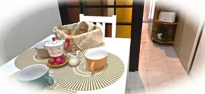 a table with a cup of coffee and a basket of food at A casa di chi, Family, Near Metro in Rome