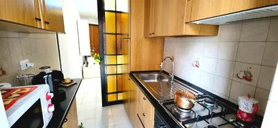 a small kitchen with a sink and a stove at A casa di chi, Family, Near Metro in Rome