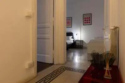 an open door to a room with a bedroom at Giuliana Apartment Vatican in Rome