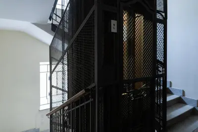 an open door in a stairwell with a stair railing at Giuliana Apartment Vatican in Rome