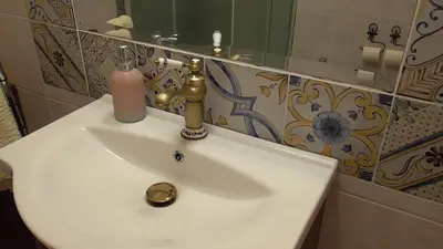 a bathroom sink with a soap dispenser on it at Italian romance - A fine apartment in Rome in Rome
