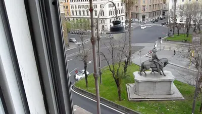 a window with a statue of a man riding a horse at Apartment Vatican Vista in Rome