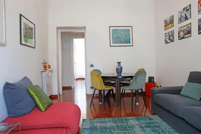 a living room with a table and chairs at Valerio’s House in Rome