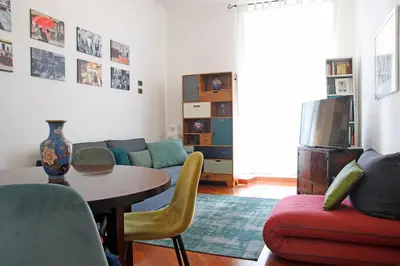 a living room with a table and a couch at Valerio’s House in Rome