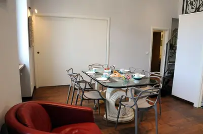 a dining room with a table and chairs at A Casa di Lu, al Colosseo - Guest House in Rome