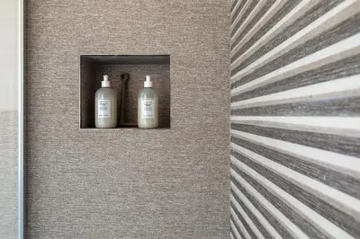 three bottles in a niche in a wall at Vatican Stunning 2 BR Apartment in Rome