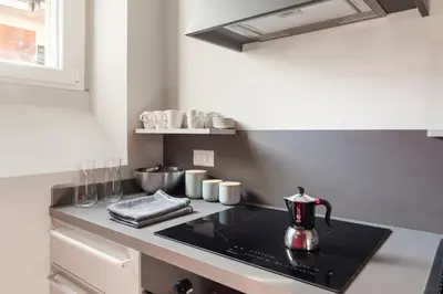 a kitchen counter with a tea kettle on a stove at Vatican Stunning 2 BR Apartment in Rome