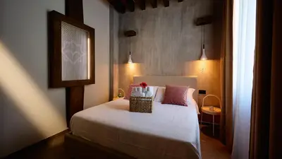 a bedroom with a bed with a basket on it at Mamaco Roma in Rome