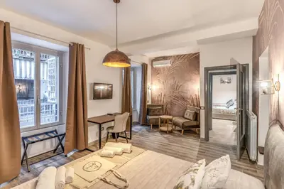 a living room with a couch and a table at NALA & KIRA - Two big apartments for groups in the center of Rome in Rome