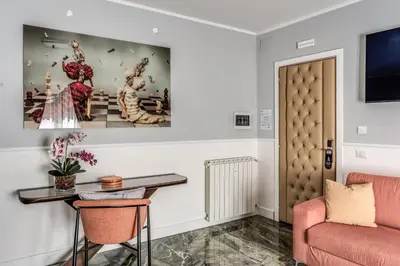 a living room with a table and a couch at Spanish Step Dream Suites in Rome