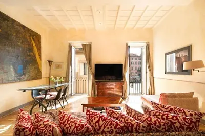 a living room with a couch and a table at Farnese Designer Loft by Romeloft in Rome