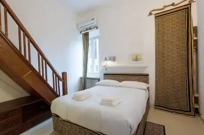 a bedroom with a bed with two towels on it at Farnese Designer Loft by Romeloft in Rome