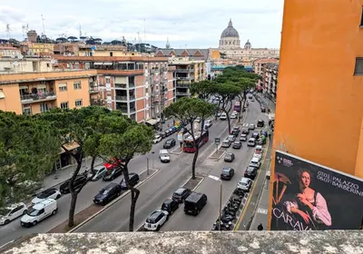 a view of a busy city street with cars at Il Nido di San Pietro - Cozy 2BR - Near Vatican in Rome