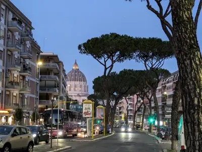 a city street with the capitol building in the background at Il Nido di San Pietro - Cozy 2BR - Near Vatican in Rome