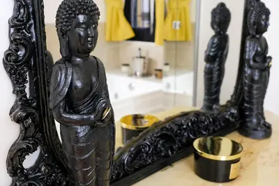 a statue of a woman in front of a mirror at Dea Clodia studio flat in Rome