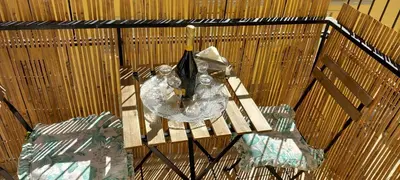an overhead view of a table with wine bottles and glasses at Domus Appio Latino - Parco Appia Antica in Rome