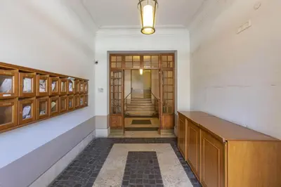 a hallway with a door and stairs in a building at Sweet House Campo de’ Fiori in Rome