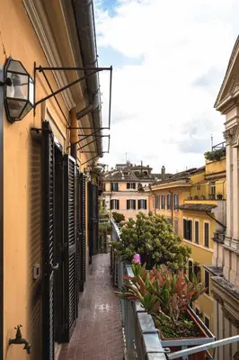an alley in a city with buildings and plants at Cesarina Home in Rome