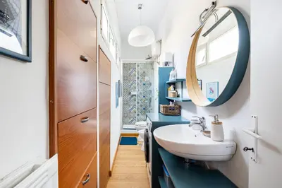 a bathroom with a sink and a mirror at Donna Olimpia tra Gianicolo e Trastevere in Rome