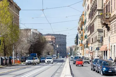 a busy city street filled with cars and buildings at Colosseum bright two Bedroom Apartment in Rome