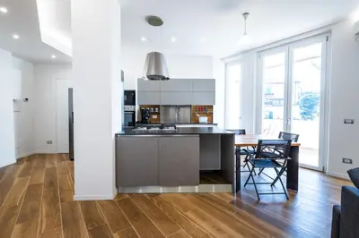 a kitchen and dining room with a table and chairs at Casa del Marchese del Grillo in Rome