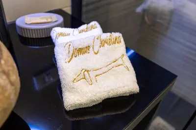 a towel with the words jamaica written on it on a table at Domus Christina in Rome