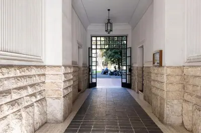 an empty hallway of a building with a door at WMR Apartment near Vatican in Rome