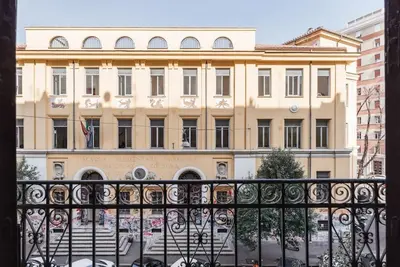 a large building in front of a building at WMR Apartment near Vatican in Rome