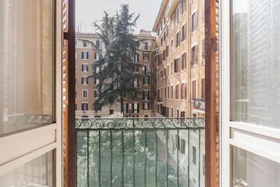 an open window with a view of a city at WMR Apartment near Vatican in Rome
