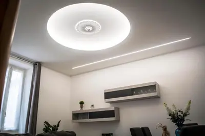 a ceiling light in a living room with at Portami a Roma in Rome
