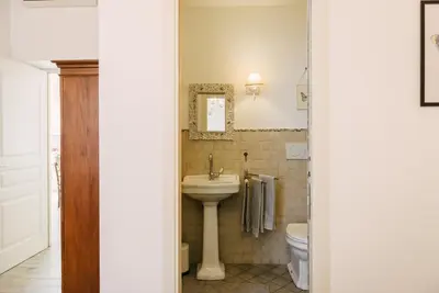 a bathroom with a sink and a toilet at Casa Riva 1920 in Rome