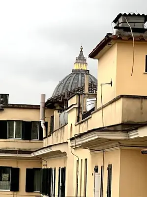 a building with a dome on top of it at La Casa del giornalista - ItalyHolidayHouse in Rome