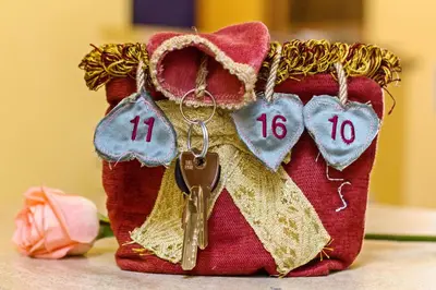 a bag with a pair of keys and hearts at Vatican Domus in Rome
