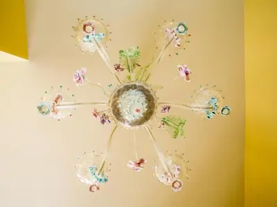 a chandelier hanging from a wall at Vatican Domus in Rome