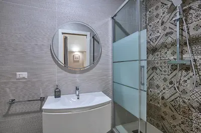 a bathroom with a sink and a mirror at Casa Pallini Luxury Apartment in Rome